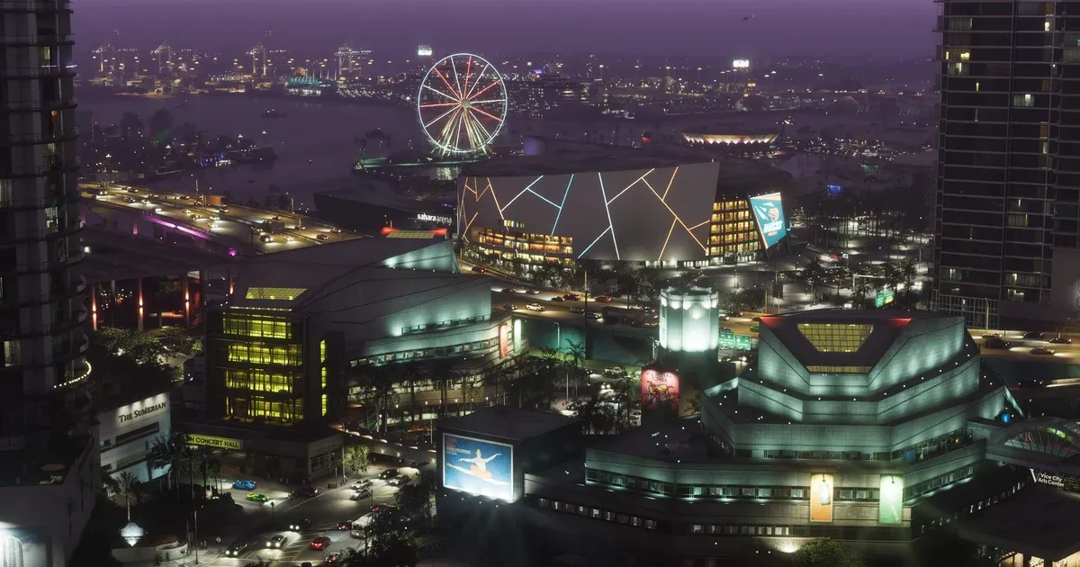 Una vista nocturna del centro de Vice City en GTA 6 con una noria iluminada, una arena resplandeciente y rascacielos junto al paseo marítimo
