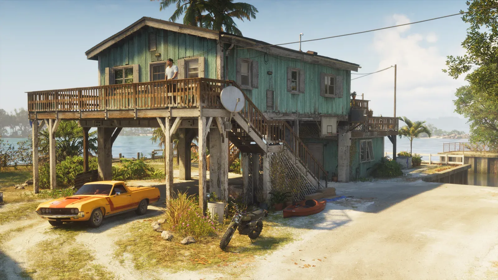 A Vapid Ganado muscle coupe utility and a green off-road motorcycle parked outside Jason's stilt house safehouse in the Leonida Keys